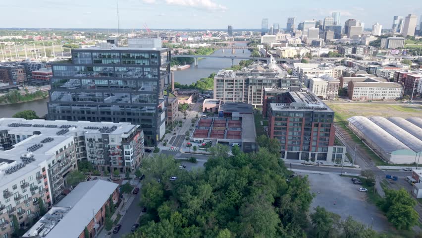 Germantown, the Neuhoff Residences, and the Nashville downtown skyline along the Cumberland River - forward aerial flyover