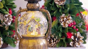 Snow globe with a child in the manger on a festive Christmas background, symbolizing the nativity and holiday spirit in a flat lay composition. - Powered by Shutterstock - Get 15% off with code: PIKWIZARD15