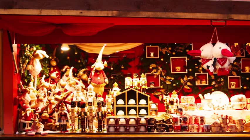 Festive Christmas market in Strasbourg, France, bustling with holiday shoppers, twinkling lights, decorated stalls, and seasonal decorations — a magical European Christmas scene.