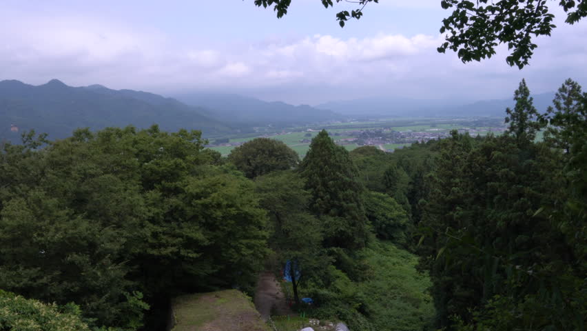 The outskirts of Murakami City as seen from the castle ruins on the mountaintop in Japan. without sounds