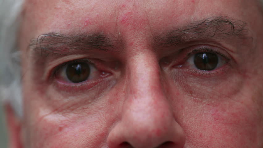 Close-up of middle-aged man’s eyes and eyebrows showing focus and depth, conveying introspection, seriousness, and realism with natural skin detail