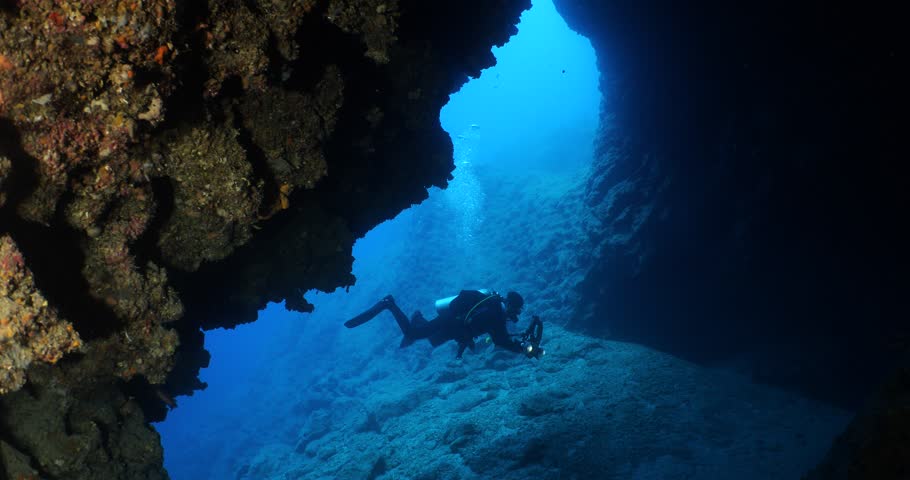 scuba divers are exploring and enjoying the caves underwater cave dive