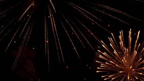 A bright firework explodes in the night sky, scattering sparks and vivid light trails. The scene captures the dynamic glow and dramatic visual effects of the fireworks display. - Powered by Shutterstock - Get 15% off with code: PIKWIZARD15