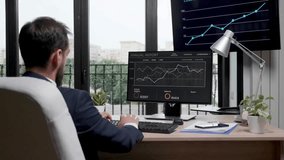 Zoom-in of a businessman working on a computer in a modern office, analyzing sales graphs, highlighting productivity, finance, and business performance. - Powered by Shutterstock - Get 15% off with code: PIKWIZARD15