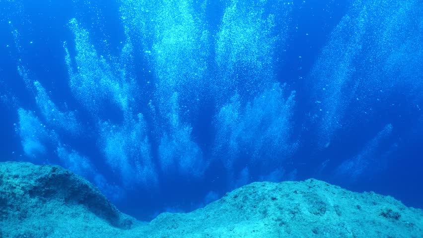 air bubbles slow  underwater coming up scenery dark blue and sun shine ocean scenery from scuba  divers backgrounds