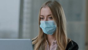 Portrait Caucasian business woman typing laptop wearing face medical mask businesswoman in office female entrepreneur girl marketing manager using corporate software coronavirus covid19 pandemic sick - Powered by Shutterstock - Get 15% off with code: PIKWIZARD15