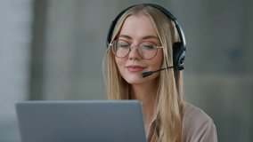 Caucasian business woman in headset talking video call with laptop in office girl female businesswoman helpline agent customer service call center help line manager wearing headphones with microphone - Powered by Shutterstock - Get 15% off with code: PIKWIZARD15