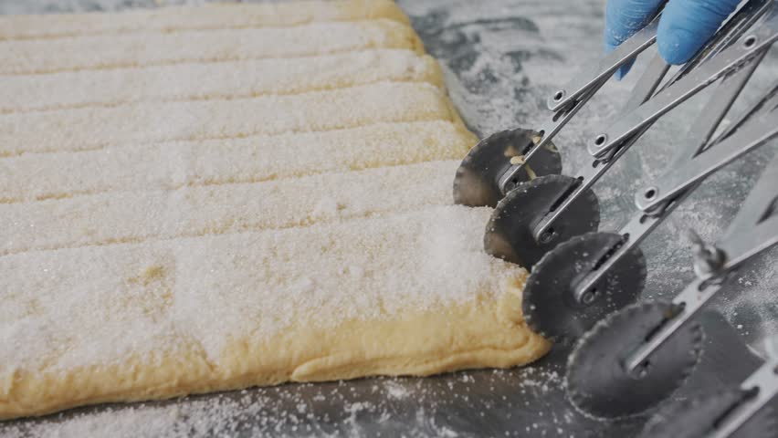 Cutting Cookie Dough With Pastry Wheels. Bakery production