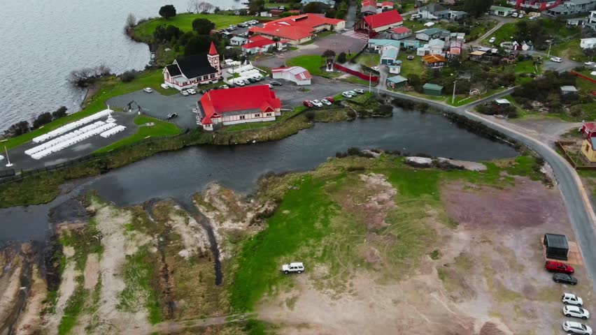 Captured on 21 November 2025, this stunning aerial photograph showcases the historic Anglican Church and Te Papaiouru Marae situated in the heart of Ohinemutu Village, Rotorua, New Zealand. The image 