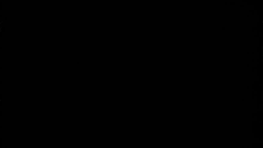 Super Slow Motion Shot of Real Glass Break at 1000 fps Isolated on Black Background.