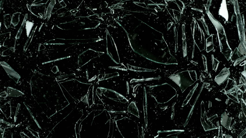 Super Slow Motion Shot of Real Glass Break at 1000 fps Isolated on Black Background.
