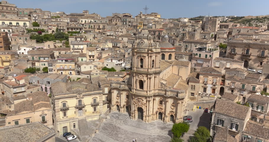 Aerial view of the facade of the Cathedral of San Giorgio, located in Modica, in the province of Ragusa, Sicily, Italy. It is a symbolic monument of Sicilian Baroque and the town