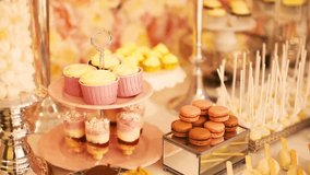 Cute wedding candy bar decorated with assorted cakes, candies, jars, and sweet treats. Perfect dessert table setup for receptions, parties, and celebration themes. - Powered by Shutterstock - Get 15% off with code: PIKWIZARD15