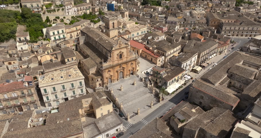Aerial view of the facade and stairs of the Cathedral of San Pietro, located in Modica, in the province of Ragusa, Sicily, Italy. It is a symbolic monument of Sicilian Baroque and a town