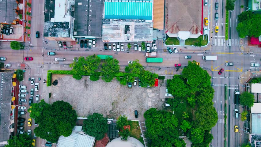 Aerial view of Barranquilla, Colombia, showcasing the city skyline, urban streets, and surrounding landscape from above.