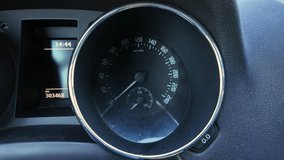 instrument cluster lighting up with speedometer and warning icons during startup, closeup of circular gauge with illuminated indicators and odometer, moody cabin light and textured dial face - Powered by Shutterstock - Get 15% off with code: PIKWIZARD15