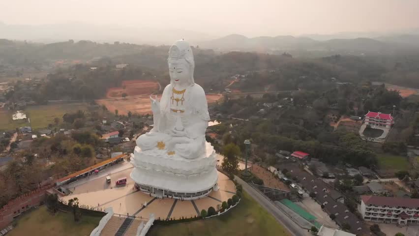 Aerial view of the Guan Yin statue in Thailand, showcasing the majestic religious monument, serene surroundings, and intricate cultural architecture.