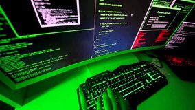 Malicious code on a widescreen typed by a black-hat hacker performing a ransomware cyberattack, stealing personal data in a dark tech environment. - Powered by Shutterstock - Get 15% off with code: PIKWIZARD15
