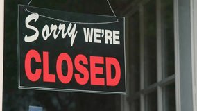 Camera tilts from a closed scene to a coronavirus sign, highlighting COVID-19 awareness, public health messaging, and pandemic-related visual communication. - Powered by Shutterstock - Get 15% off with code: PIKWIZARD15