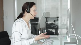 Woman working in call center, providing customer support through headset, communicating in virtual office meeting. Business people concept - Powered by Shutterstock - Get 15% off with code: PIKWIZARD15