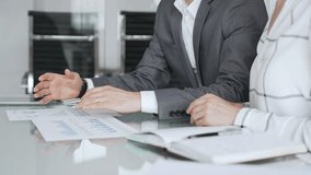 Business partners analyzing corporate data during a meeting, discussing financial reports and market trends. Business-people concept - Powered by Shutterstock - Get 15% off with code: PIKWIZARD15