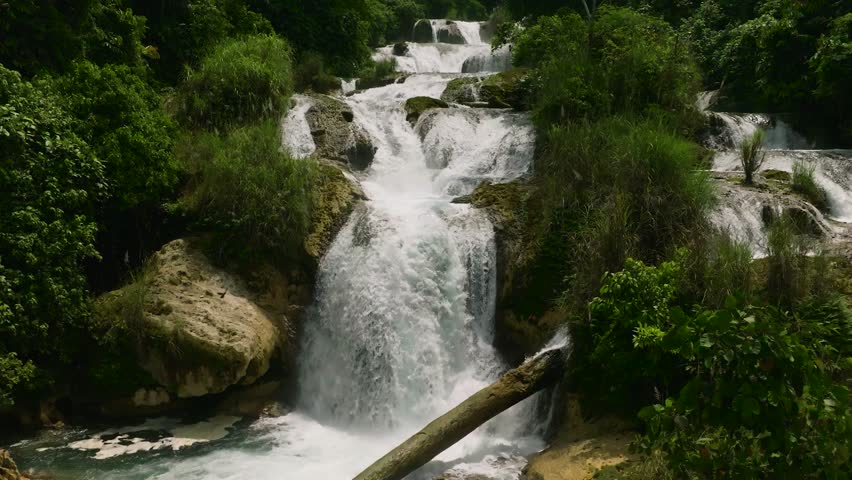 Water splash in rapid stream. Aliwagwag waterfalls in slow motion. Mindanao, Philippines.