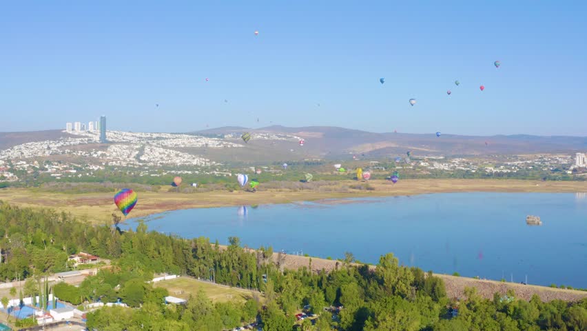 Hot Air Baloons Flying Over the Lake