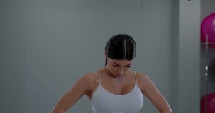 Calm female model tilting head back practicing deep breath relaxation grey background - Powered by Shutterstock - Get 15% off with code: PIKWIZARD15