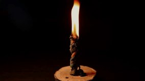 Closeup a bright fire light of power burning twisted ritual program magic candle flame in a dark. The sorcerer performs a magical rite with candles. Witchcraft and magic. mystical ritual with a spell. - Powered by Shutterstock - Get 15% off with code: PIKWIZARD15