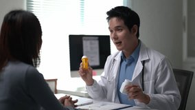 A doctor is talking to a woman in a medical office. The doctor is holding a bottle of medicine and a bottle of pills. The woman is looking at the doctor with concern - Powered by Shutterstock - Get 15% off with code: PIKWIZARD15
