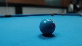 A cinematic close-up footage showing billiard balls rolling smoothly on a green pool table. The scene captures the precision and focus of the game, featuring the cue ball. - Powered by Shutterstock - Get 15% off with code: PIKWIZARD15