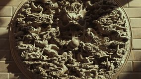 Stone Relief Sculpture of Dragons and Clouds in Circle - Powered by Shutterstock - Get 15% off with code: PIKWIZARD15