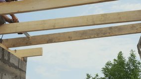 Worker Cutting Wooden Rafters with Chainsaw - Powered by Shutterstock - Get 15% off with code: PIKWIZARD15