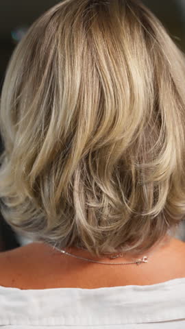 Beautifully styled blonde hair close-up.