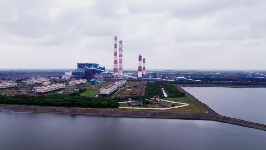 NTPC Kudgi Thermal Power Plant with Reservoir, sky and clouds. day time, semi circle shot, drone shot, 4k.
