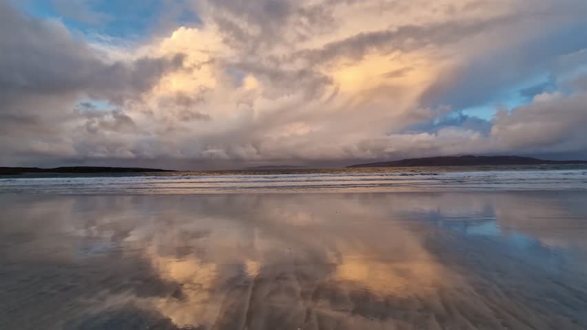 Rain falling on the beach during beautiful sunset at Portnoo Narin beach in County Donegal - Ireland