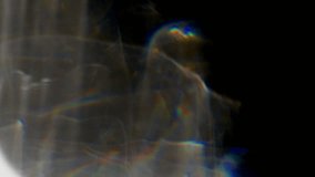 Light shines through glass creating beautiful abstract colorful rainbow patterns. Black background. Dynamic unique overlay. UHD footage - Powered by Shutterstock - Get 15% off with code: PIKWIZARD15