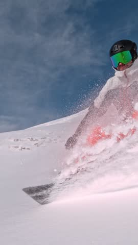 Off Piste Snowboarder Running Down. Super Slow Motion, 1000 fps. Snowboarding on Free Ride off Piste Slope in European Dolomites Mountains, Italy. Speed Ramp Effect.