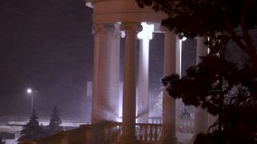 Fabulous view of the snow-covered city park at night, with trees in the snow, cozy warm light of lanterns. It's time for Christmas holidays, winter walks, a combination of the city and nature. - Powered by Shutterstock - Get 15% off with code: PIKWIZARD15