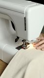 Top Angled View of Female Hands Sewing on a Sewing Machine. Vertical Video - Powered by Shutterstock - Get 15% off with code: PIKWIZARD15