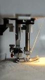 Side View of Sewing Machine Stitching with Light Thread, Finishing with a Short Backstitch. Viertical Video - Powered by Shutterstock - Get 15% off with code: PIKWIZARD15