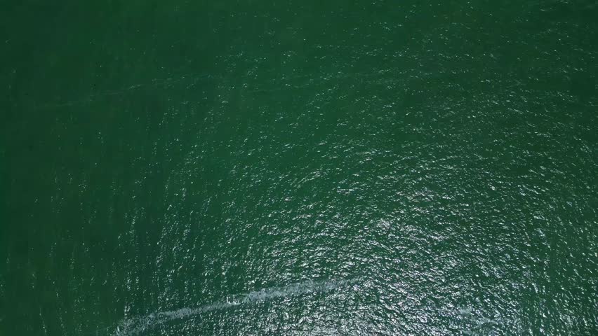 Torbay, South Devon, England: DRONE VIEWS: An overhead view of Thatcher Rock, which is an island rock located just off the mainland. Torbay is a popular UK holiday destination (Clip 2 of 6).