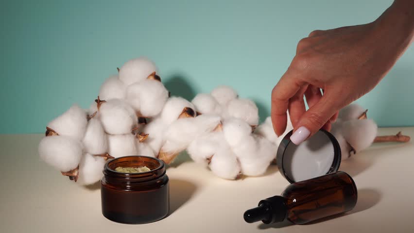 brown jar of cream on a light background