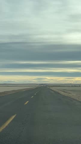 POV Drive Down a Quiet Remote Road With Vast Prairie Horizon