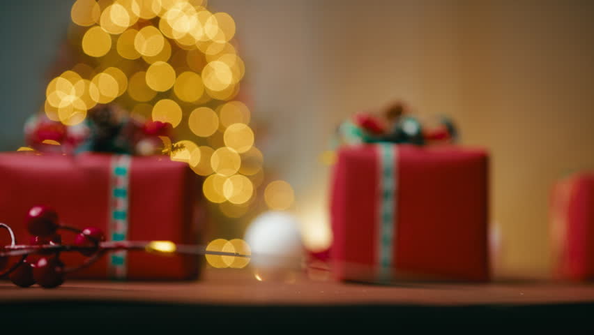 Hand Holding a Christmas Decoration White Ball