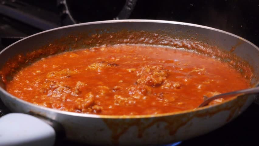 pasta sauce cooking in pan , bolognaise
