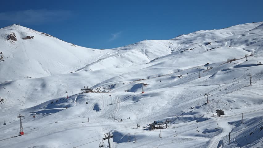 Snow covered ski slopes and chairlifts in Valle Nevado, Andes Mountains, Chile	