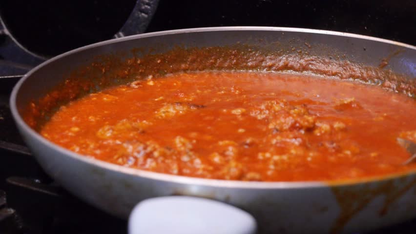 pasta sauce cooking in pan , bolognaise