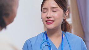Asian compassionate nurse speaking with elderly patient showing attentive care and conversation clinic elderly care nurse with stethoscope uniform provides medical support and emotional comfort - Powered by Shutterstock - Get 15% off with code: PIKWIZARD15