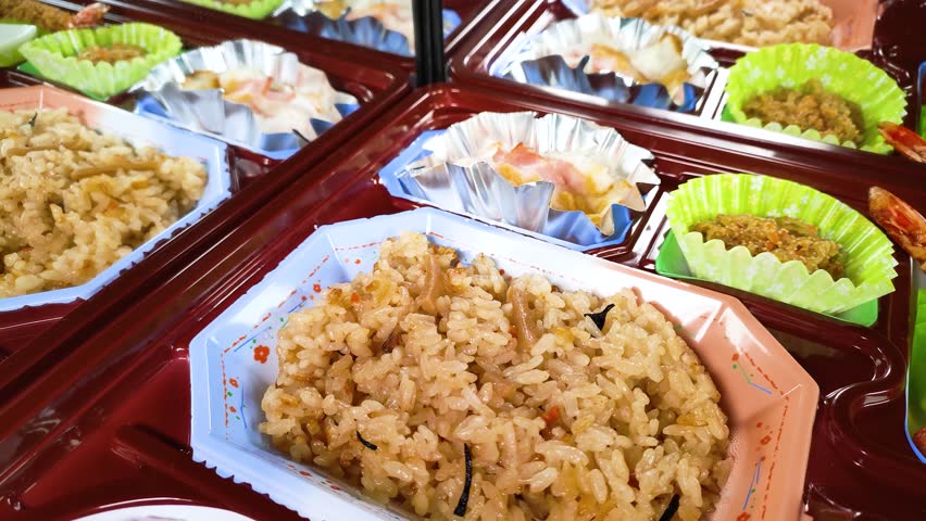 Japanese catered lunch box reflected in the mirror, rotating
